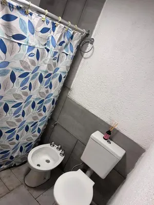 a bathroom with a toilet and a bidet at Sami LLankay II in Villa Ciudad Parque