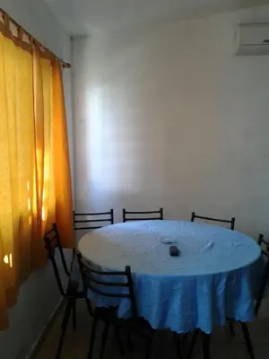 a table in a room with a blue table cloth at Fernando in Villa Independencia