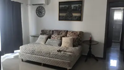 a living room with a couch and a table at Departamento en Veneto 4 u 8 in Villa Carlos Paz