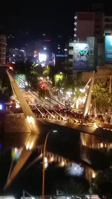 a city at night with traffic on a bridge at Departamento en Veneto 4 u 8 in Villa Carlos Paz