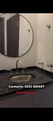 a bathroom with a sink and a mirror at Departamento en Veneto 4 u 8 in Villa Carlos Paz