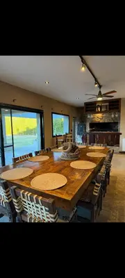 a large conference room with a large wooden table and chairs at Villa Lourdes in La Estancia