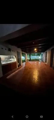 a large empty room with a large wooden floor at Sueños Del Valle in Villa Anizacate