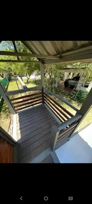 a porch with a wooden deck with a roof at Sueños Del Valle in Villa Anizacate