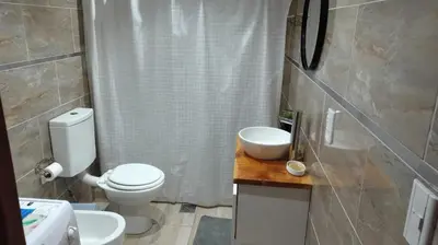 a bathroom with a toilet and a sink at Tu Escapada in Santa María