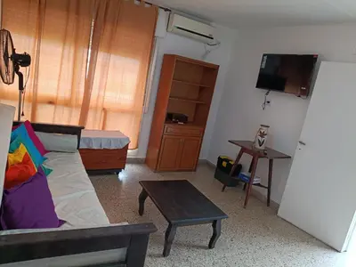 a living room with a couch and a table at Deptos Charito in Cordoba