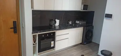a kitchen with a counter top and a dishwasher at Hermoso Departamento en Opera Plaza al lado de Quality Espacios in Cordoba