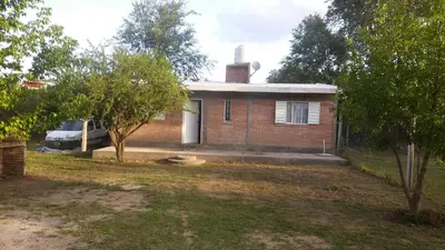 a brick house with a chimney on top of it at Departamentos Paz Serrana in Villa Cura Brochero
