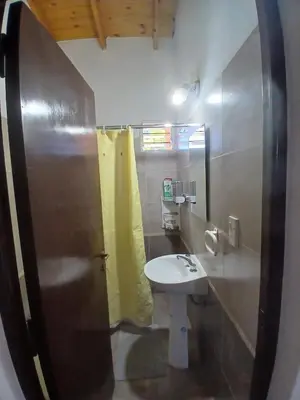 a bathroom with a sink and a toilet at Apart La Jose in Río Cuarto