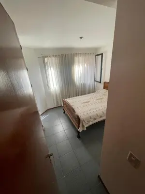 a bedroom with a bed in a room with a window at Nueva Córdoba in Cordoba