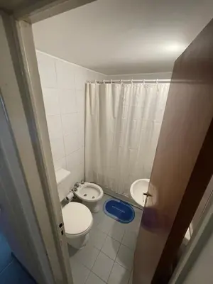 a small bathroom with a toilet and a sink at Nueva Córdoba in Cordoba