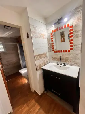a bathroom with a sink and a toilet at Las Catitas in Villa Carlos Paz