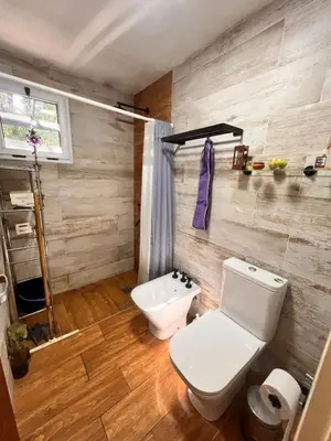 a bathroom with a toilet and a sink at Las Catitas in Villa Carlos Paz