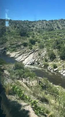 a view of a river with trees and a mountain at Villa Pellegrini in Trapiche