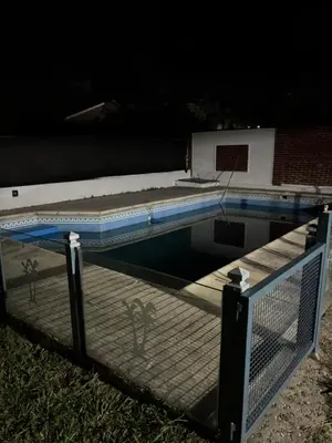 a swimming pool with a fence around it at La casa del Sapo Pepe Carlos Paz in Cordoba