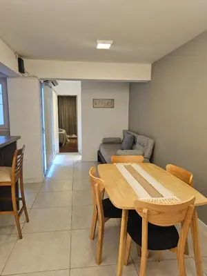 a living room with a table and a couch at NelidaMaria in Cordoba