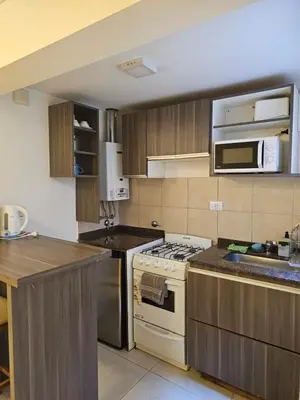 a kitchen with a white stove and a sink at NelidaMaria in Cordoba