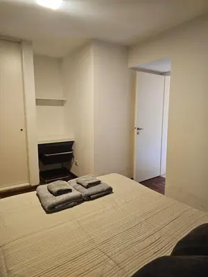 a bedroom with a bed with two towels on it at NelidaMaria in Cordoba