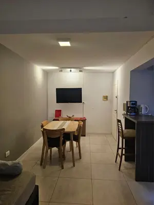 a dining room with a table and chairs in a room at NelidaMaria in Cordoba