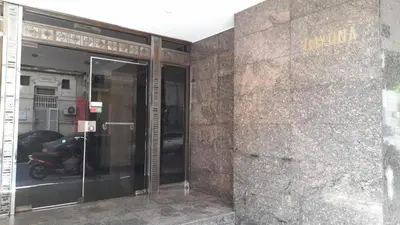 an entrance to a building with a motor scooter inside at Kalimera Loft con patio, único en Córdoba Capital in Cordoba