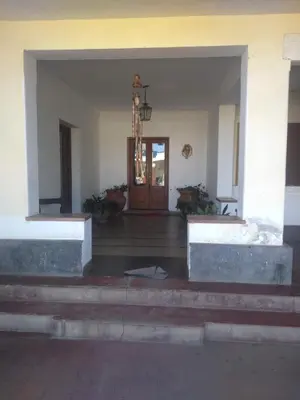 an emptyoyer with a door and stairs in a building at Estancia San Carlos in Villa del Dique