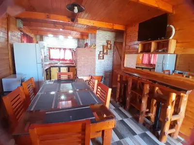 a dining room with a long table in a cabin at Cabaña de montaña potrero de garay in Potrero de Garay