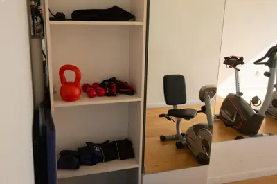 a room with a gym with a treadmill and weights at Gral Paz Apartment, Pileta Gym y vistas Unicas in Cordoba