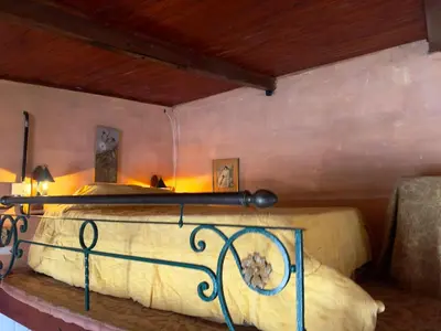 a bedroom with a bed in a room at Villa il Fanale in Alpa Corral