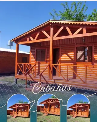 a wooden cabin with a fence in front of it at Cabañas para 4 personas M y M Cabañas in Villa Yacanto