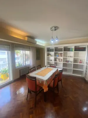 a dining room with a table and chairs at Piso Ejecutivo PREMIUM in Cordoba
