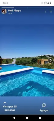 a picture of a swimming pool on a website at CABAÑAS L y L in Villa Santa Cruz del Lago