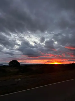 a sunset on the side of a road at Selah in Villa de Las Rosas
