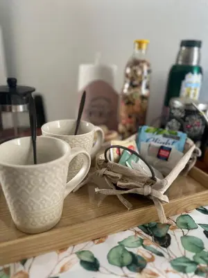 two coffee cups sitting on a wooden tray at RyC La Casita Mirador Del Lago in Villa Parque Siquiman
