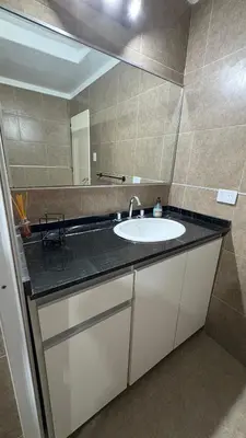 a bathroom with a sink and a mirror at Casa de campo, Dique Chico in Villa Anizacate