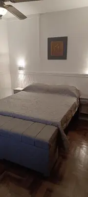 a bedroom with a bed in a room at Departamento Grande 3 Dormitorios con Cochera in Cordoba