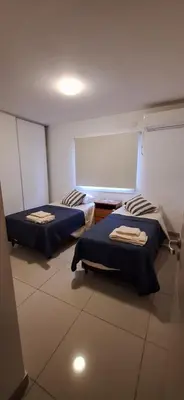 a room with two beds in a room at Lo de Lili in Cordoba