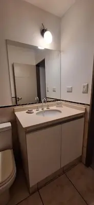 a bathroom with a sink and a large mirror at Lo de Lili in Cordoba