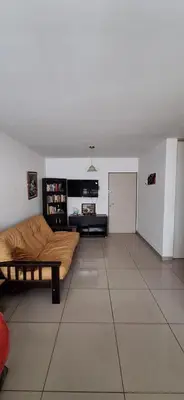 a living room with a couch and a table at Lo de Lili in Cordoba