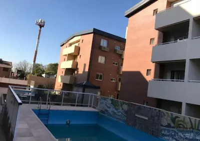 a balcony with a swimming pool in front of a building at Lo de Lili in Cordoba