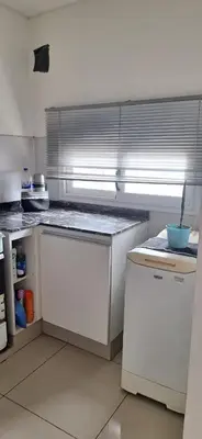 a kitchen with white cabinets and a counter top at Lo de Lili in Cordoba