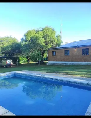 a swimming pool in front of a house at Green mile in San Roque