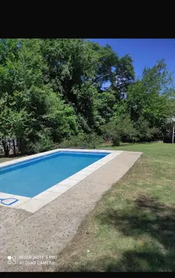 a swimming pool in the middle of a yard at Green mile in San Roque