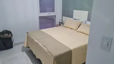 a bedroom with a bed in a room with a window at Romina Cañada in Cordoba