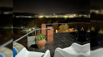 a view of a balcony with a plant in a pot at Casa con hermosa vista al lago in Villa Carlos Paz