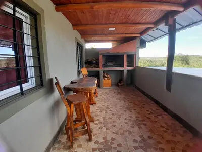 a room with a table and chairs in a house at Mi sueño en la naturaleza in Potrero de Garay