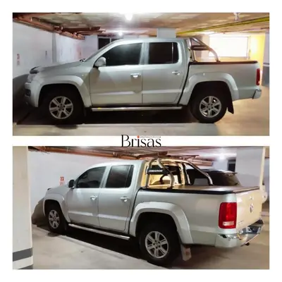 a silver truck is parked in a garage at Brisas Departamento Boutique in Villa Carlos Paz