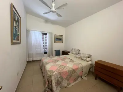 a bedroom with a bed and a ceiling fan at Casa Edison in Villa Carlos Paz