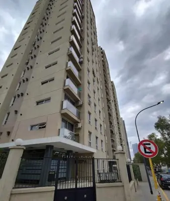 a tall building with a sign in front of it at Apartment in Córdoba capital in Cordoba