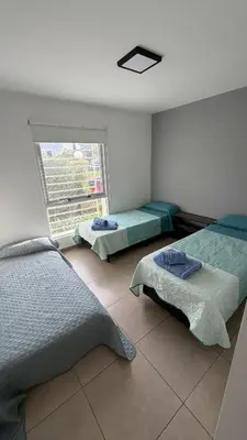 a bedroom with two beds and a window at Apartment in Córdoba capital in Cordoba