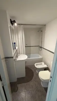 a bathroom with a toilet and a sink and a tub at Apartment in Córdoba capital in Cordoba